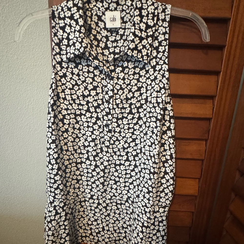 CAbi Black and White Buttoned Notched Collar Blouse w/cute peplum hem!